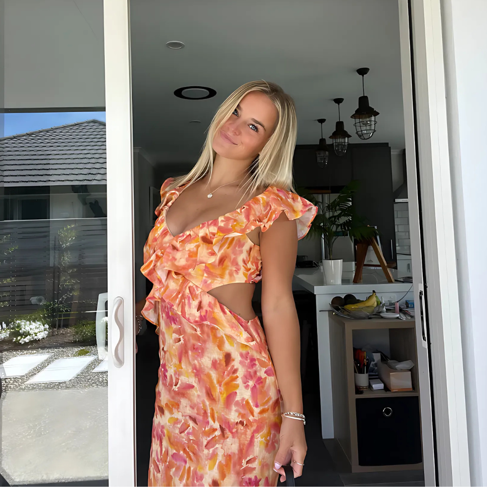 Aneliese Schmeichelndes Sonnengeküsstes Sommerkleid für Damen in Orange, mit fließender Silhouette und lebendigem Blumendruck, perfekt für sonnige Tage.
