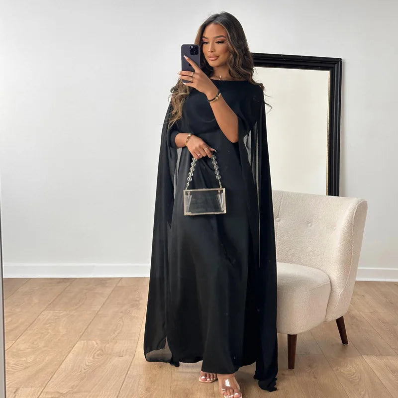 Anneli elegantes fließendes Kleid für Damen in Schwarz, mit einer eleganten Passform und einer stilvollen Silhouette, ideal für formelle Veranstaltungen und Abendanlässe.