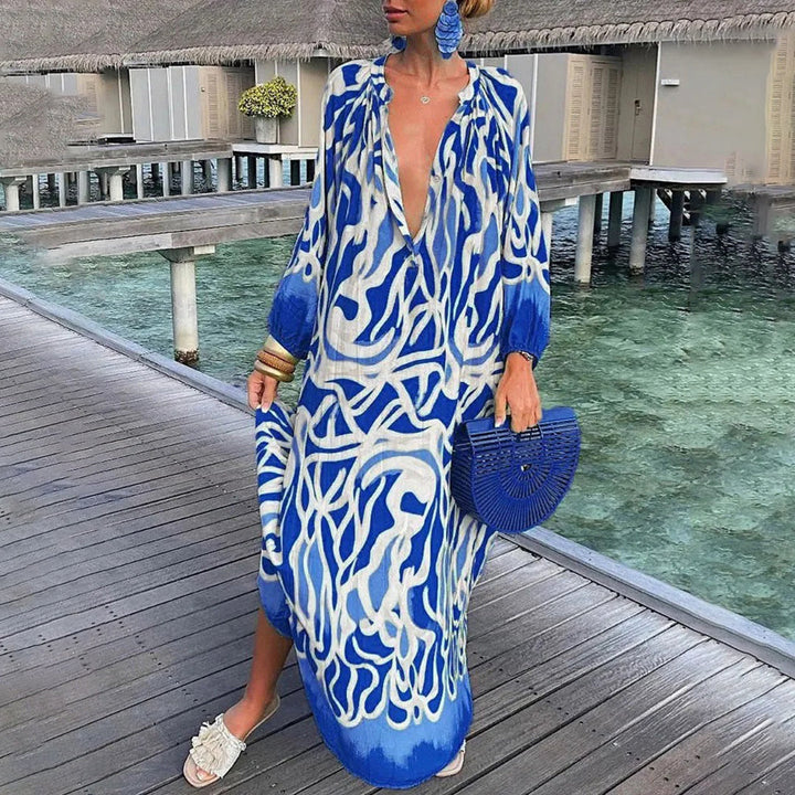 Arnette stilvolles Boho-Kleid für Damen in Blau, mit einem wunderschönen Boho-Print und leichtem Stoff, perfekt für Sommerabenteuer.
