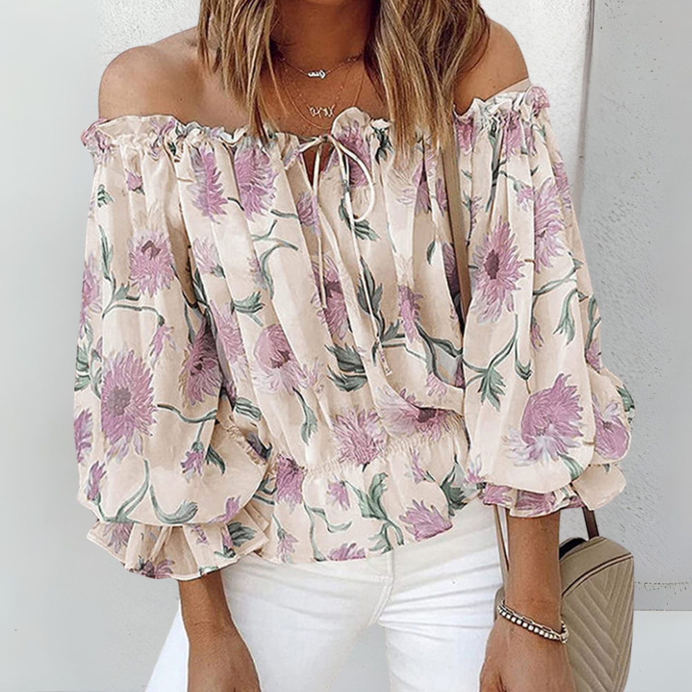 Atmungsaktive Sommerbluse für Damen in Lila mit Blumenmuster – leichte Damenbluse für warme Sommertage.