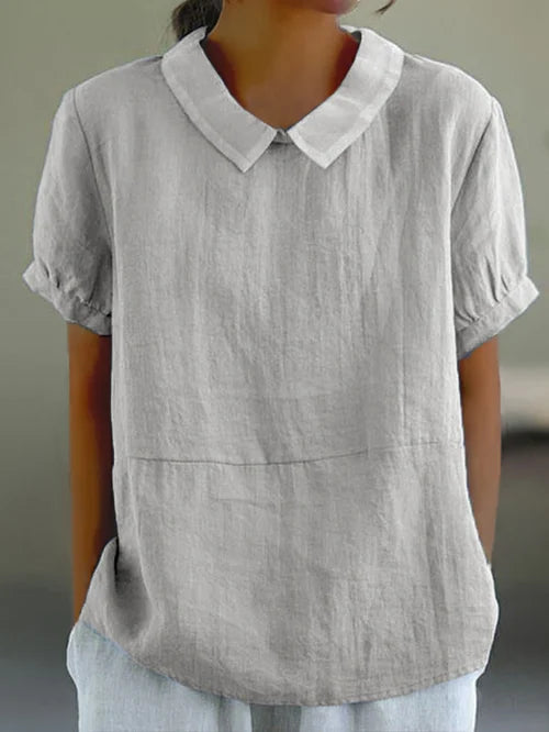 Vielseitige graue Bluse mit entspannter Passform und Kragen für Frauen, die einen schicken Look für legere oder halbformelle Anlässe bietet. Atmungsaktiver Stoff sorgt für Komfort.