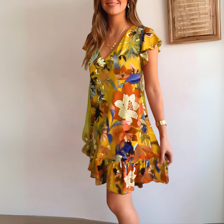 Eshana leichtes Sommerkleid für Damen in Gelb, mit einem fröhlichen und luftigen Design, ideal für Outdoor-Veranstaltungen und sonnige Tage.