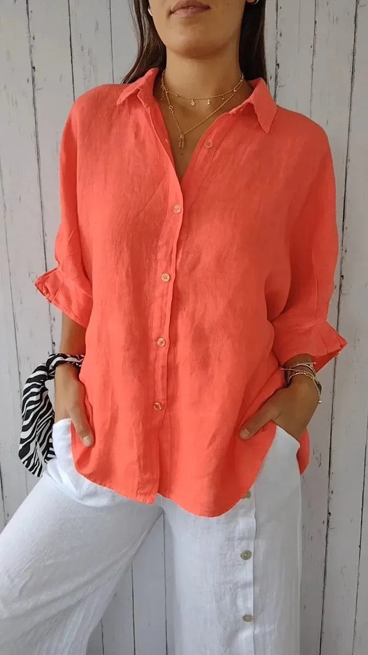 Lebendige orange Baumwoll-Leinen-Bluse für Damen, die einen kühnen und frischen Stil in Ihre legere Garderobe bringt und atmungsaktives Material bietet.