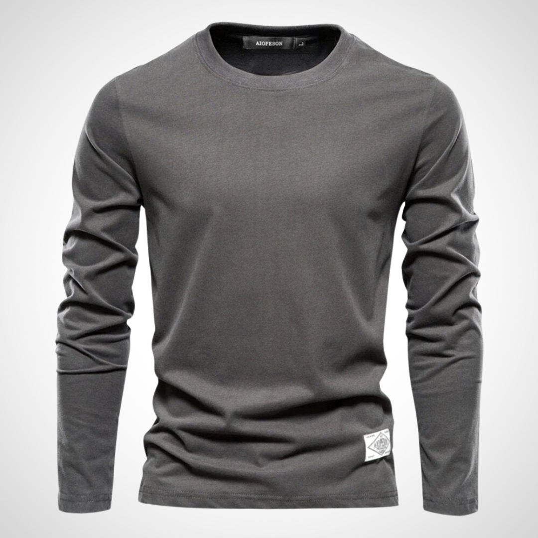 Langarmshirt in Dunkelgrau mit klassischem Rundhalsausschnitt, atmungsaktivem Baumwollmaterial und schlichten, einfarbigen Design für Herren.