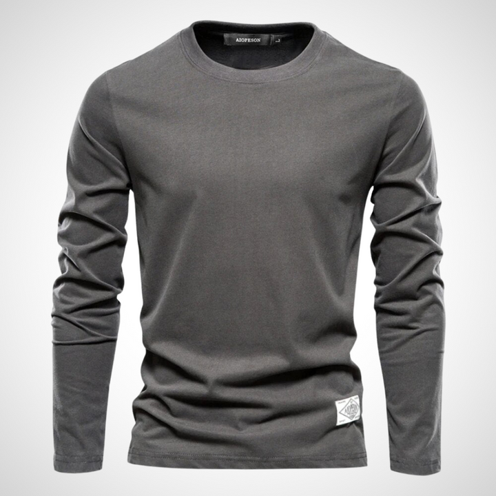 Langarmshirt in Dunkelgrau mit klassischem Rundhalsausschnitt, atmungsaktivem Baumwollmaterial und schlichten, einfarbigen Design für Herren.
