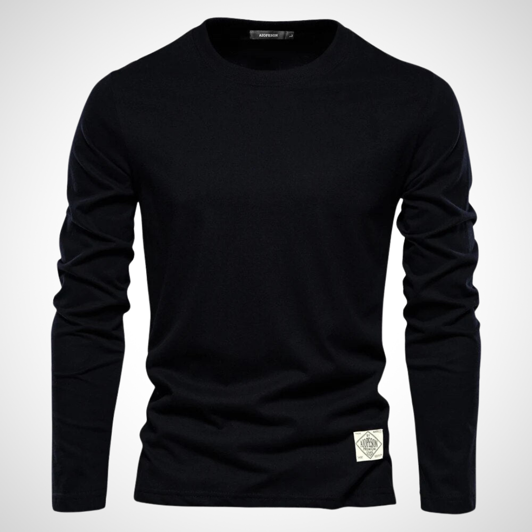 Langarmshirt in Schwarz mit klassischem Rundhalsausschnitt, atmungsaktivem Baumwollmaterial und schlichten, einfarbigen Design für Herren.
