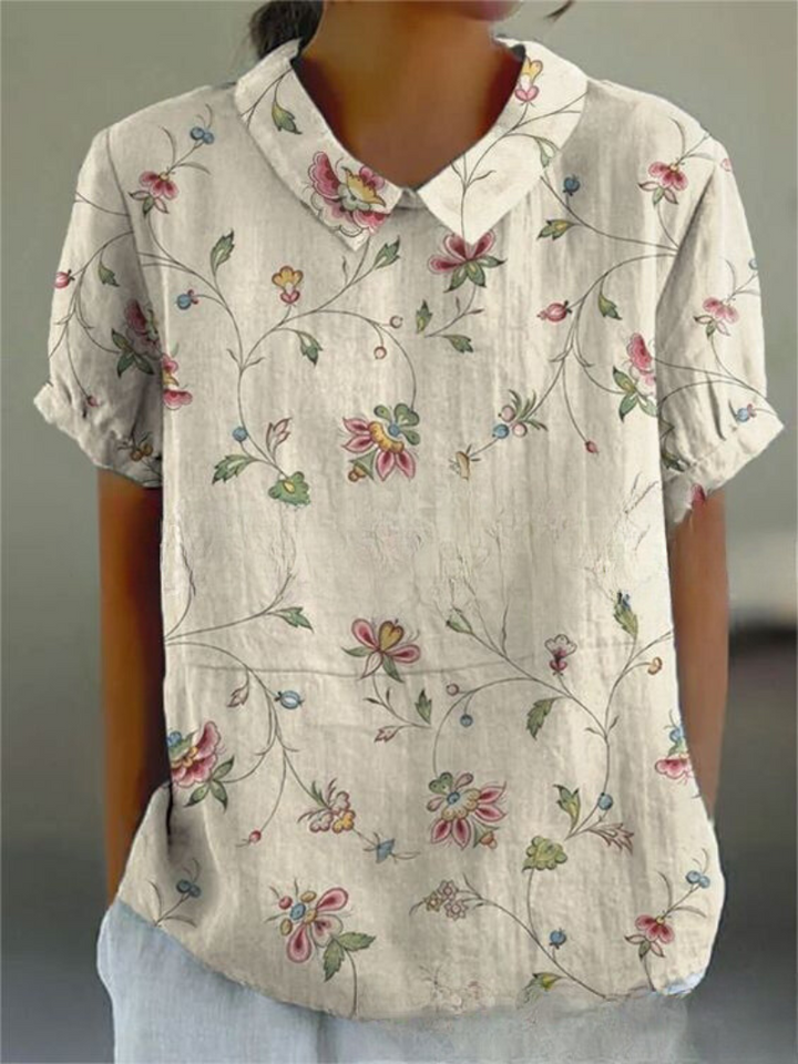 Sanftes aprikosenfarbenes Blumenbluse für Damen, perfekt für warmes Wetter und legere Veranstaltungen mit einer frischen und sanften Ausstrahlung