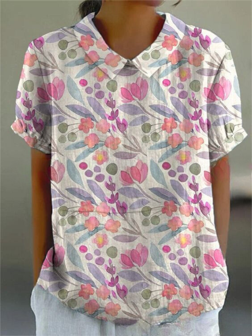 Ein feminines weißes Blumenbluse für Damen mit einem schönen Blumenmuster, perfekt für Frühling und Sommer
