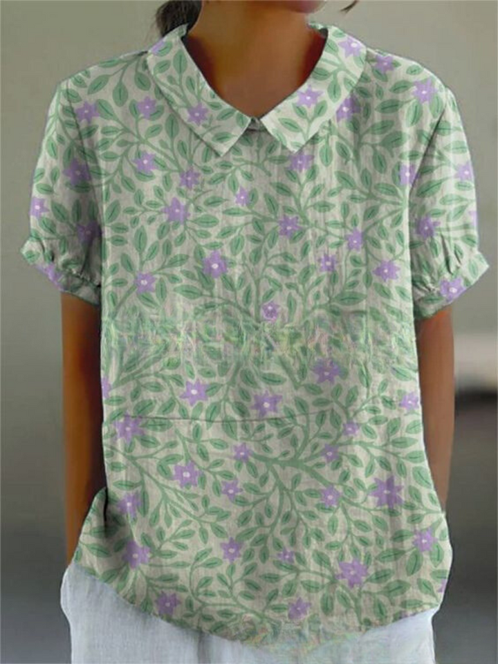Frisches grünes Blumenmusterbluse für Damen, das einen lebendigen und naturinspirierten Look bietet, perfekt für Frühlings- und Sommeroutfits