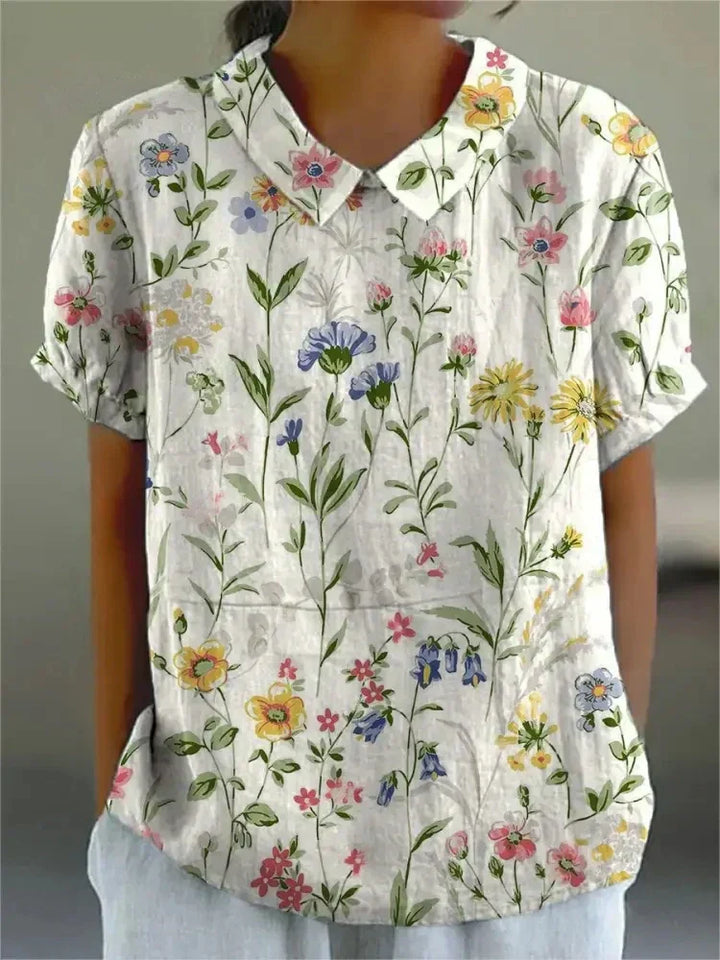 Elegantes weißes Blumenbluse für Damen mit zarten Blumenmustern, ideal für legere Ausflüge oder Veranstaltungen bei warmem Wetter