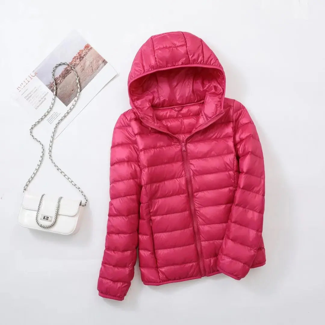 Steppjacke für Damen in Dunkelrosa mit warmer Kapuze, praktischem Reißverschluss und Wendefunktion