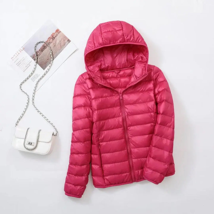 Steppjacke für Damen in Dunkelrosa mit warmer Kapuze, praktischem Reißverschluss und Wendefunktion
