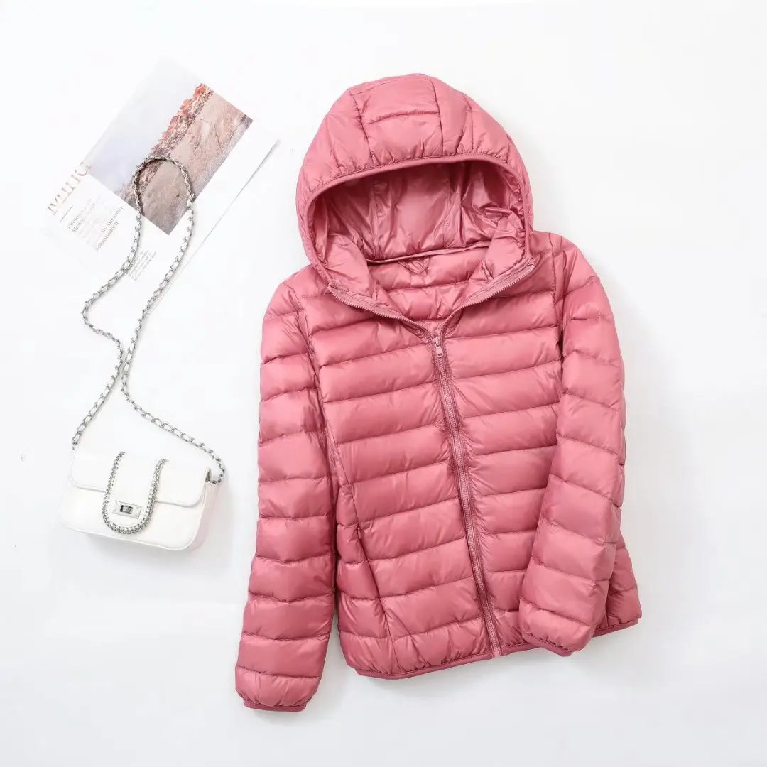 Steppjacke für Damen in Hellrosa mit warmer Kapuze, praktischem Reißverschluss und Wendefunktion