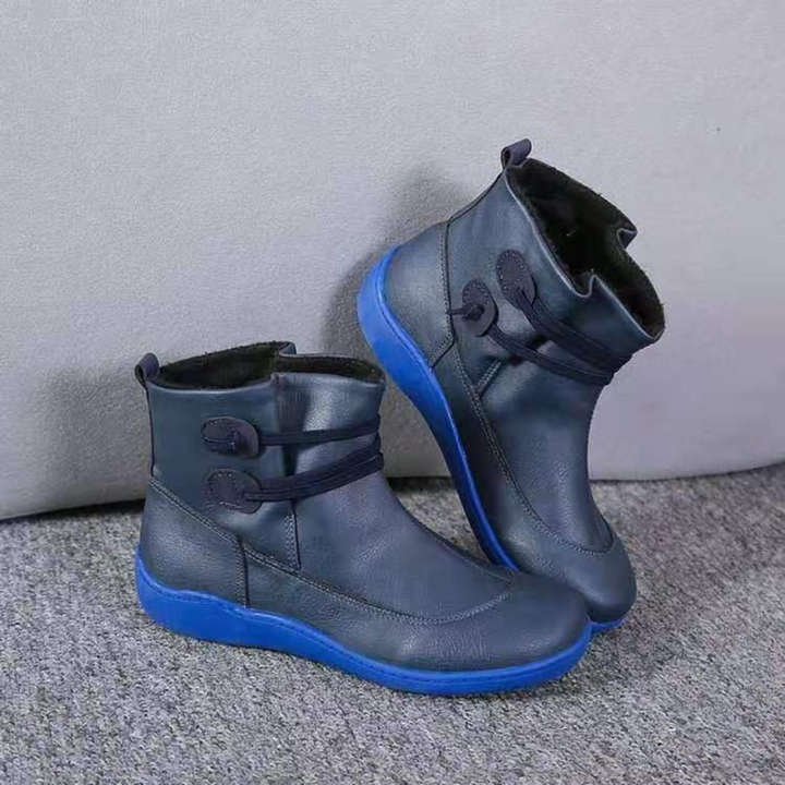Stiefel mit strukturierter Schulterpartie, tailliertem Schnitt und funktionalem Reißverschlussdesign für Damen.