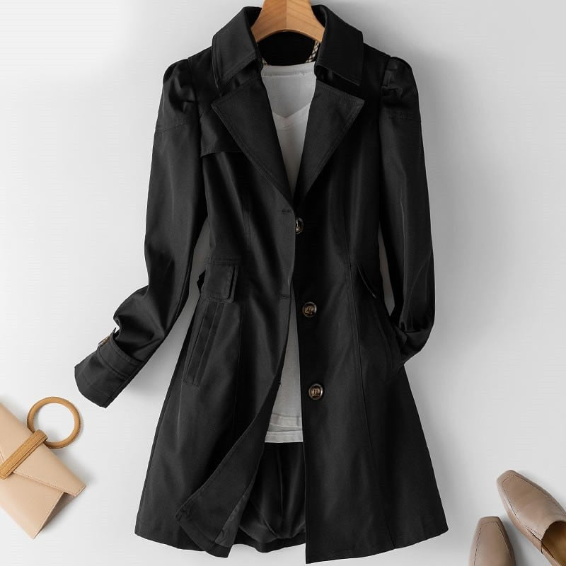Trenchcoat für Damen in Schwarz mit taillierter Passform, knöpfbaren Manschetten und Taschen mit Klappen
